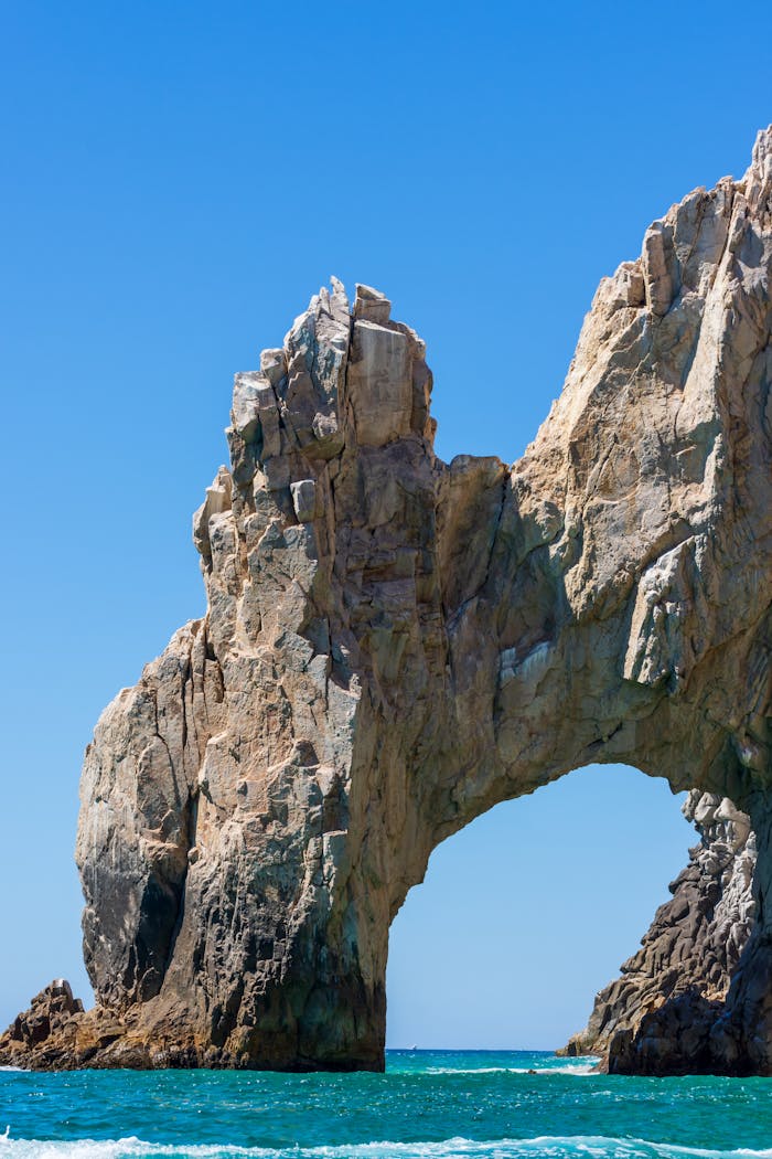 Stunning view of Cabo San Lucas's iconic arch rock formation under clear skies.